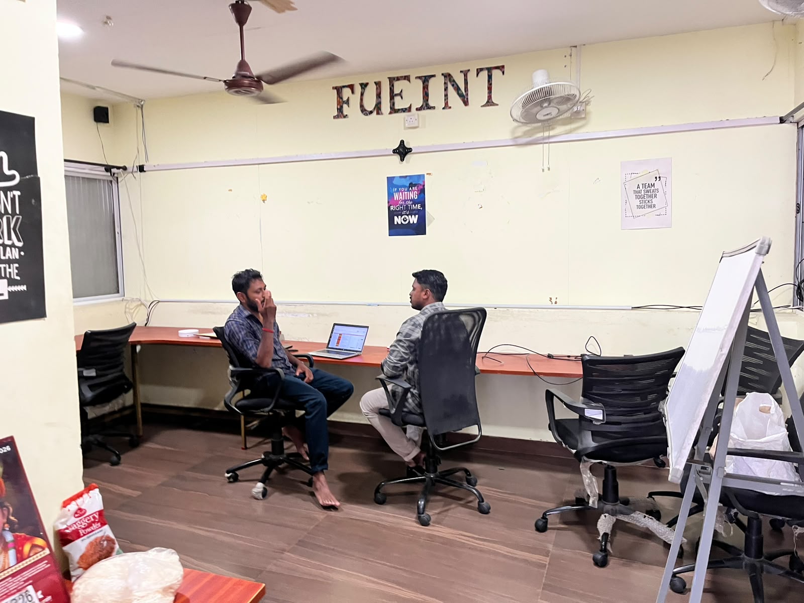 Two engineers working through a problem at FUEiNT